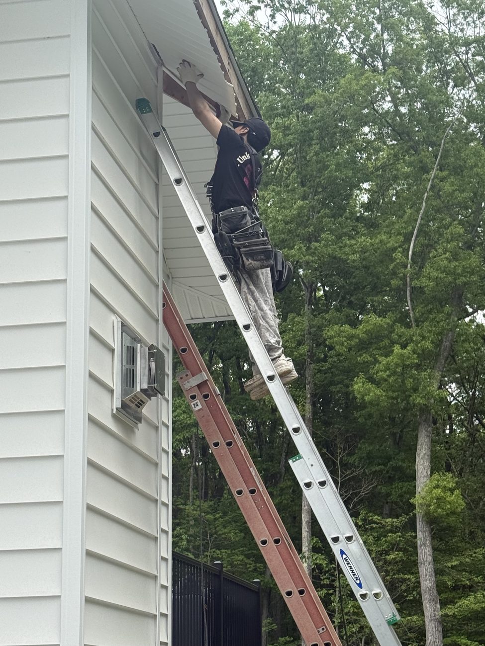 Rocco's Roofing crew doing gutter and fascia work on a Norfolk County, MA home