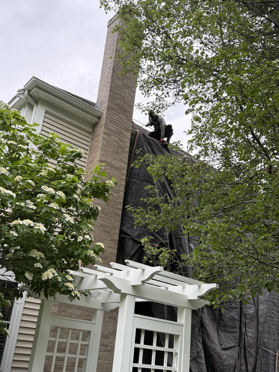 Roof replacement around a brick chimney in the Braintree, MA area