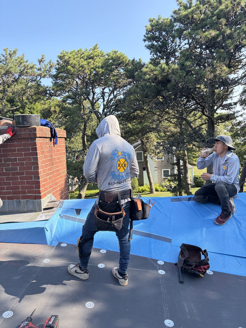 Rocco's Roofing crew replacing a roof in the Canton, MA area