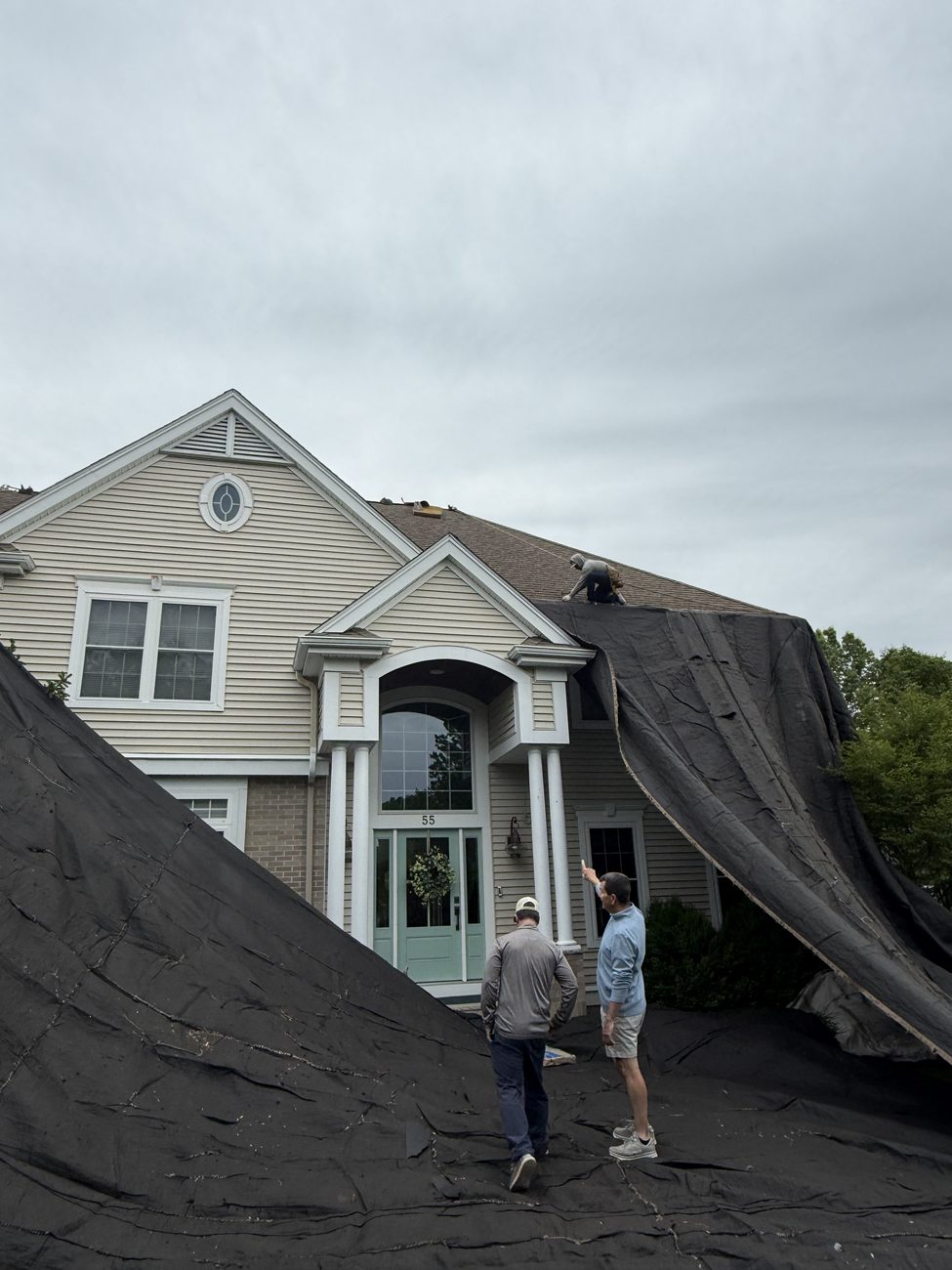 Rocco's Roofing tearing off and replacing a roof on a Norwood, MA colonial