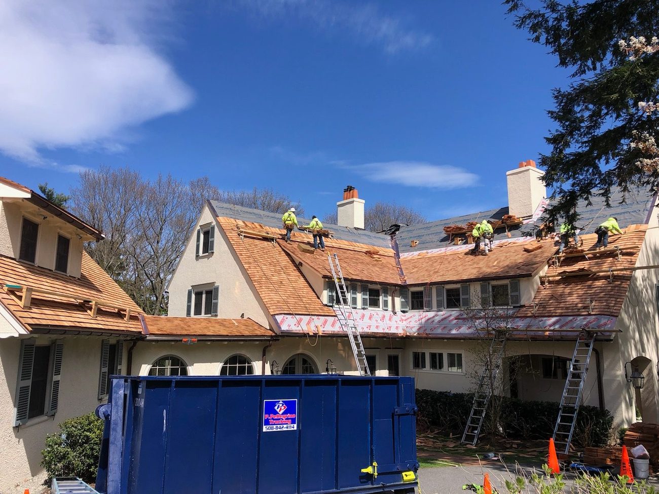 Premium cedar shake roof installation on a large Westwood, MA home